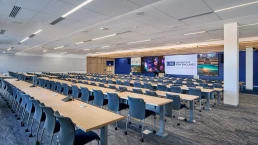 A 240-seat lecture hall with a massive 48-foot LED screen for immersive learning.