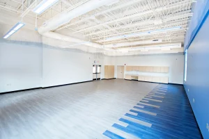 A view of the empty band room at Yarmouth High School. Large open space with lots of natural lighting.