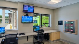 Command center at the Brunswick Fire Station, with multiple screens and control panels for emergency management.