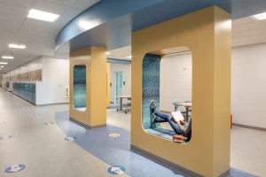 A photograph of a student enjoying the hallway reading nooks at the Camden-Rockport Middle School