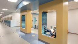 A photograph of a student enjoying the hallway reading nooks at the Camden-Rockport Middle School