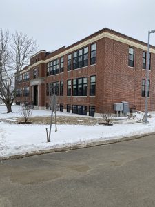 An photo of the Mary E. Taylor building exterior in the winter, with snow in the yard.
