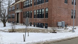 An photo of the Mary E. Taylor building exterior in the winter, with snow in the yard.